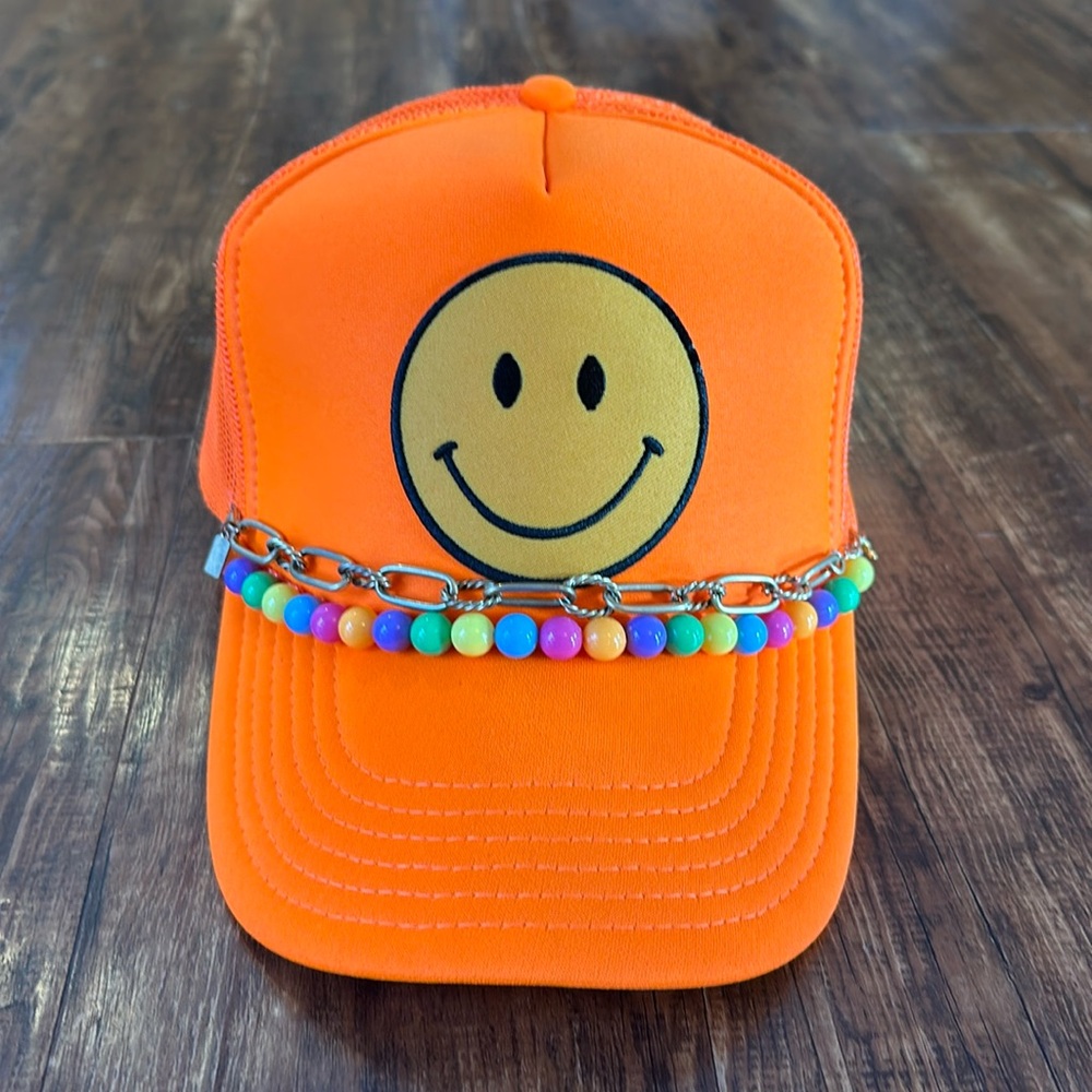 Ascot and Hart smiley face trucker hat